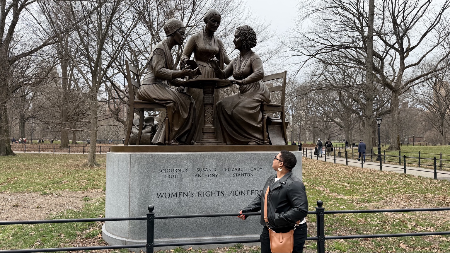 Mause-Darline Francois beside the Women's Rights Pioneers monument in Central Park, New York